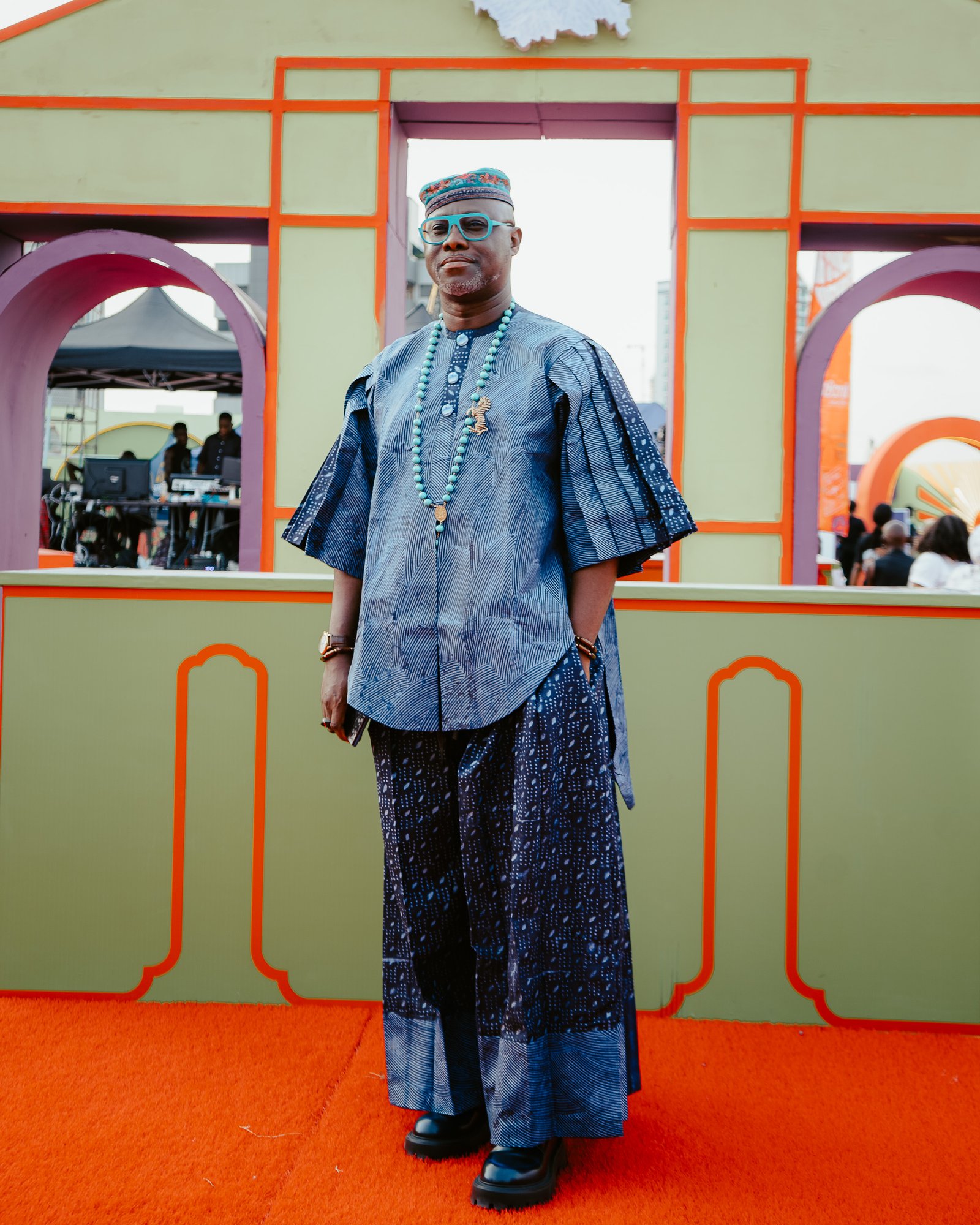 A guest in a blue embroidered outfit at Motherland Festival